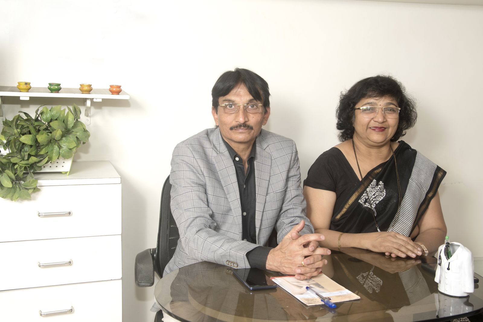 Dr. Santosh Gujarathi and Mrs. Nikita Gujarathi at the clinic